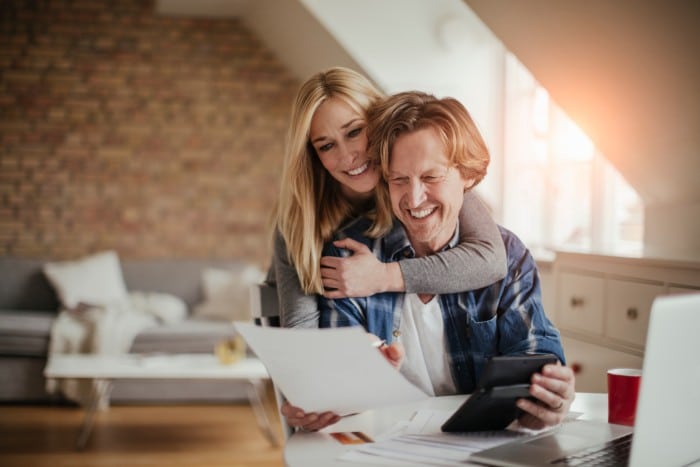 Couple celebrating investment property